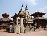 Kathmandu Bhaktapur 02-1 Bhaktapur Durbar Square Teleju Bell, King Bhupatindra Malla Column, And Vatsala Durga Temple In front of the Royal Palace in Bhaktapurs Durbar Square are the large Teleju Bell (1737), King Bhupatindra Mallas column (1699), and the shikhara-style stone Vatsala Durga Temple (1672). Much of Bernardo Bertoluccis movie Little Buddha was filmed near the Vatsala Temple. On the left is Chyasilin Mandapam, an octagonal temple rebuilt in 1990 after it was destroyed by fire in 1934.